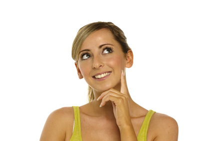 Young Woman looking up thinking isolated on a white background